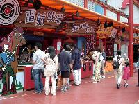 this is another picture of the shooting gallery in Hing Kong, you can see people shooting and having fun